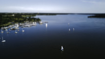 aerial view over sailboats in a bay