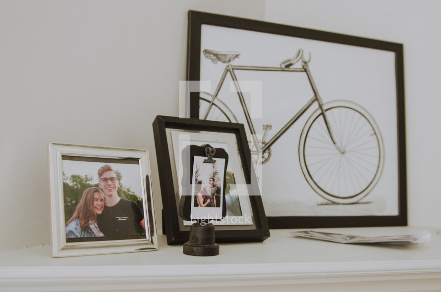 framed pictures on a mantle 