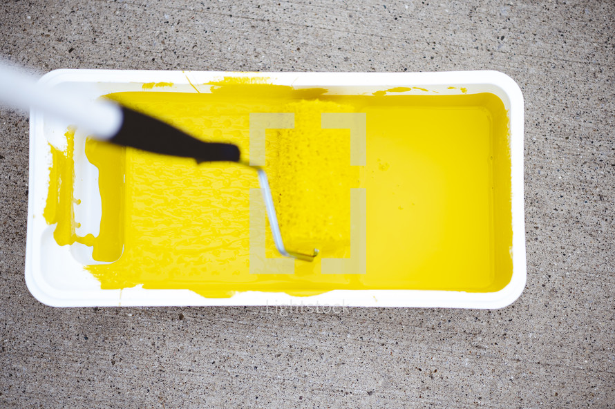 yellow painting in a paint pan 