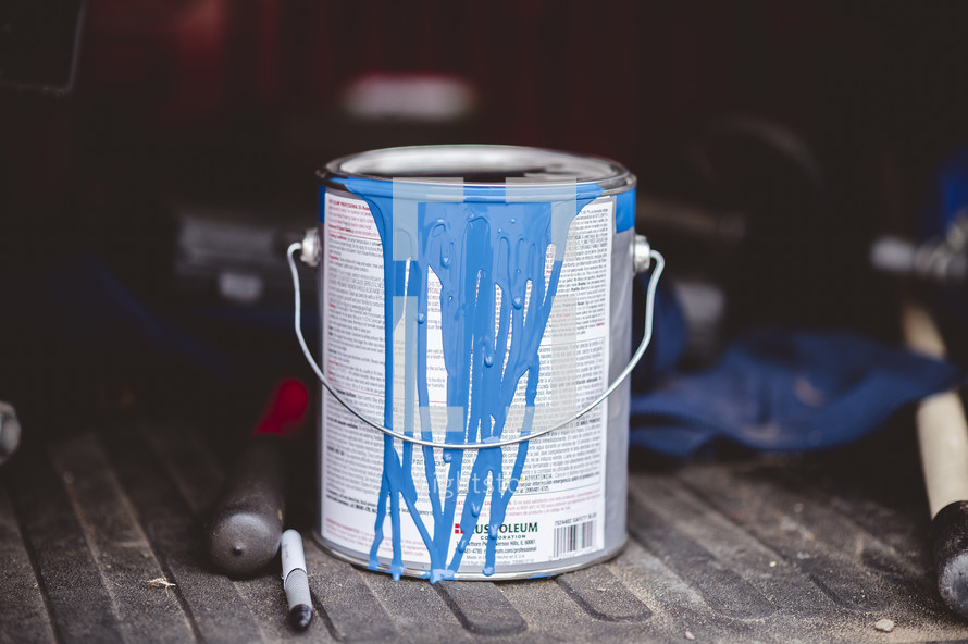 blue paint in a paint can 