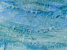 canvas with textured paint in blue green