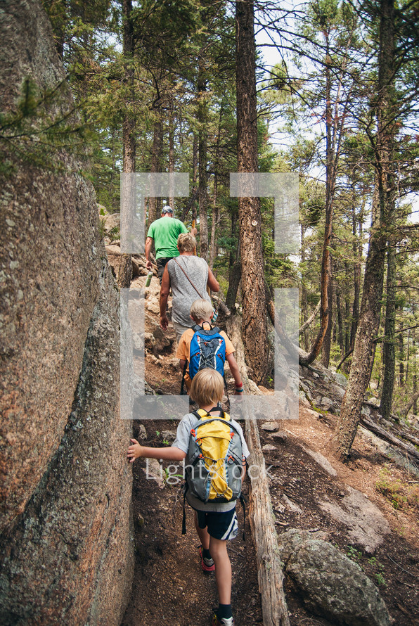 family hiking on a forest trail 
