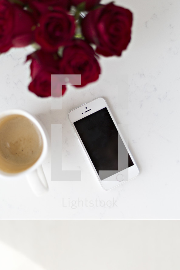 iPhone with coffee mug 