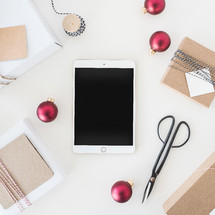 a festive Christmas desk with tablet 