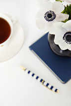tea, flowers, journal and pen