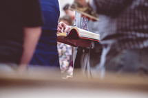 Bible holding Bibles during a worship service 