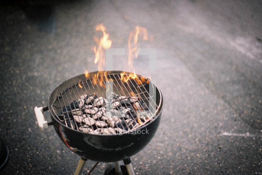 flames from a charcoal grill 