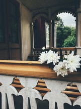 white flowers on a railing 