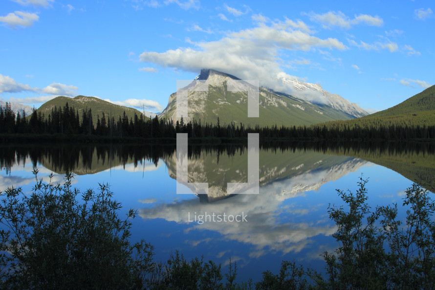 reflection of a mountain in a lake