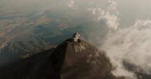 Smoky Active Fuego Volcano In Guatemala - aerial drone shot	