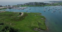 Drone flying over harbor at US east coast with sailboats