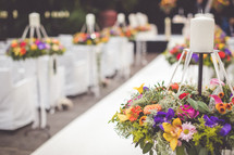 flower arrangements and tables for a wedding reception 