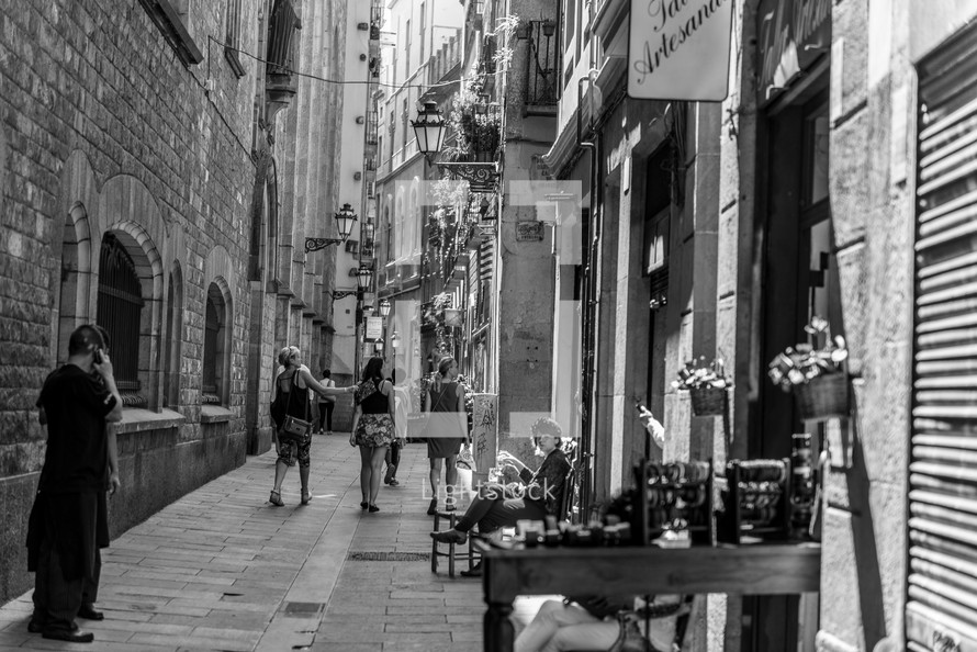 women walking down an alley 