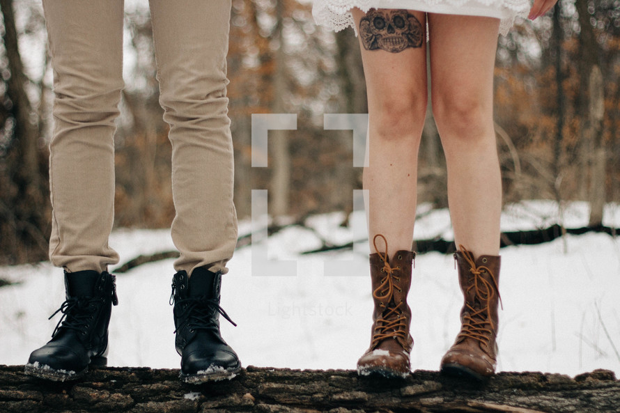 legs of a couple in snow 