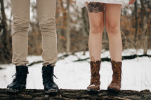 legs of a couple in snow 