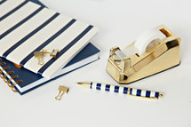 navy and gold items on a desk 