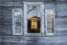 view through windows on an old farmhouse 