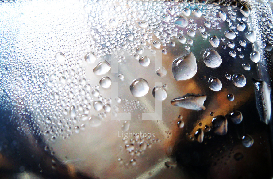 Water Droplets appear on a cold surface showing condensation and water on a cold winter morning. 