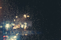 rain drops on a window and bokeh lights 