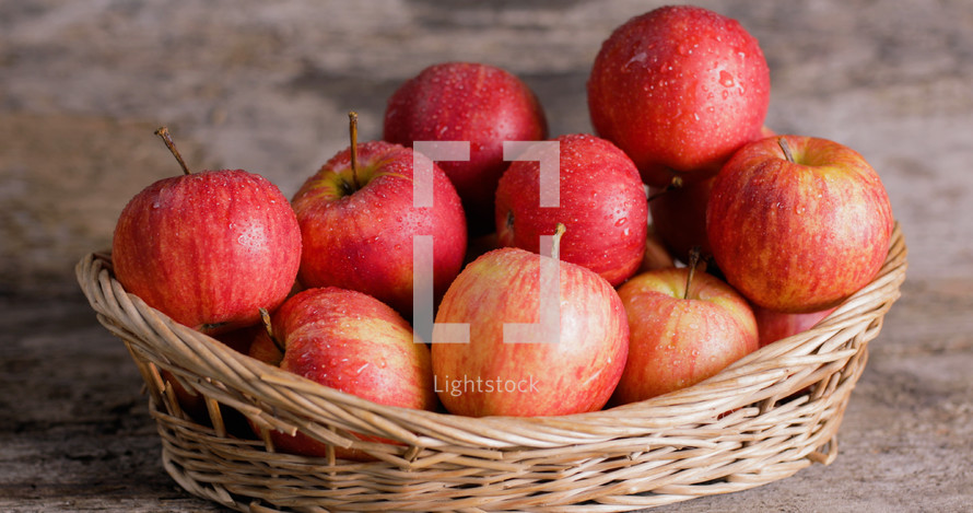 Red Apples fruit into a basket