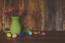 Easter eggs and tulips in a vase 