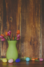Easter eggs and tulips in a vase 