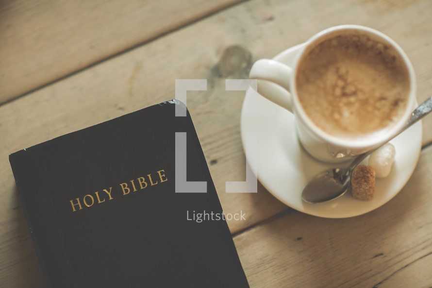 Bible and latte on a table 