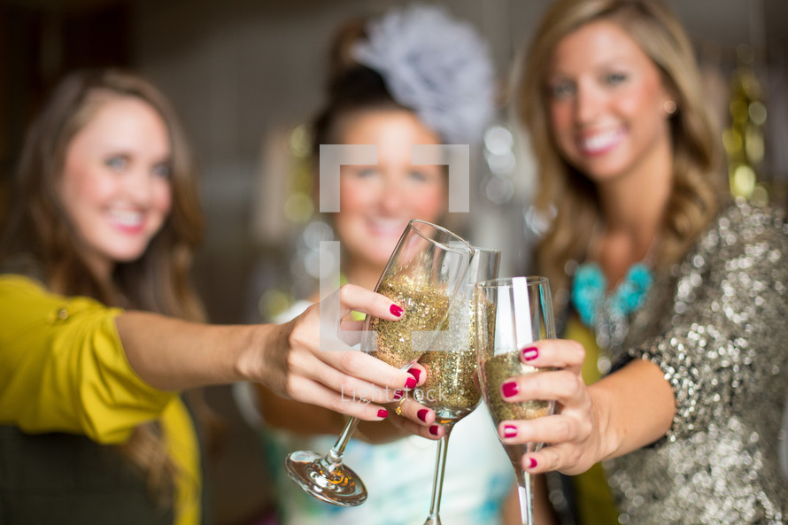 women toasting champagne glasses 