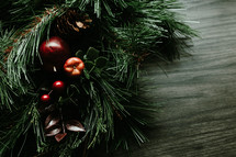Rustic Christmas garland on a dark wood background
