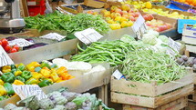 Various fruits and vegetables at a farmer's market.