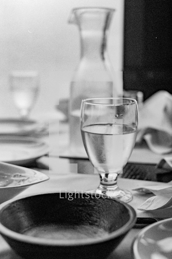 Bowl and water glass on a table - black and white