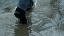 boots walking through a puddle 