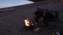 Enjoying Campfire By Mountain Lake Slow Motion