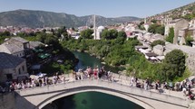 Famous arch bridge stari most over River in Mostar, tourist attraction, aerial