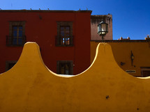 yellow wall with street lamp 