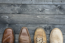 men's footwear on wood boards 