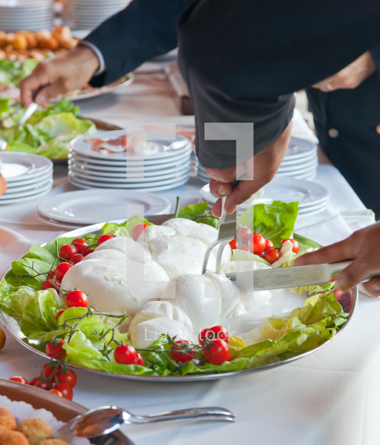 Sliced of Mozzarella in tray during a wedding reception
