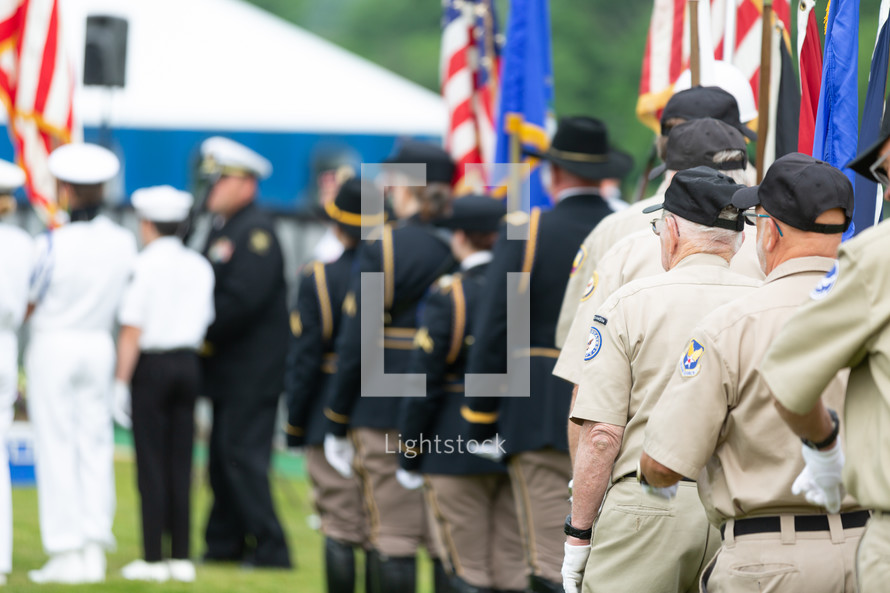 American Legion veterans assembling at outdoor event