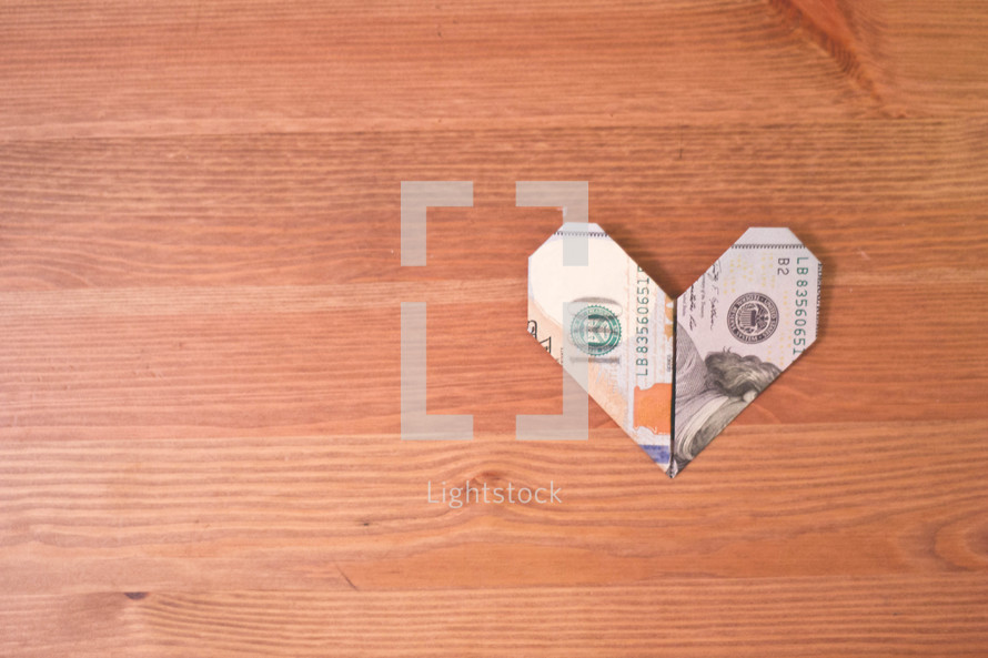money folded into the shape of heart 