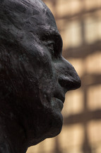 side profile of man's face statue 