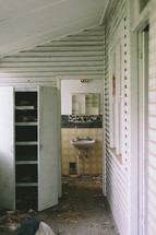 Back porch and bathroom of an abandoned house.