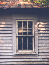 old window and red tin roof 