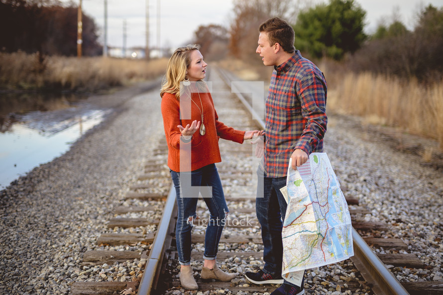 lost couple arguing over a map 