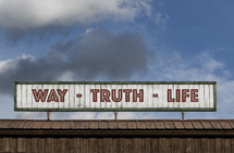 Way - Truth - Light sign on the roof of a building 