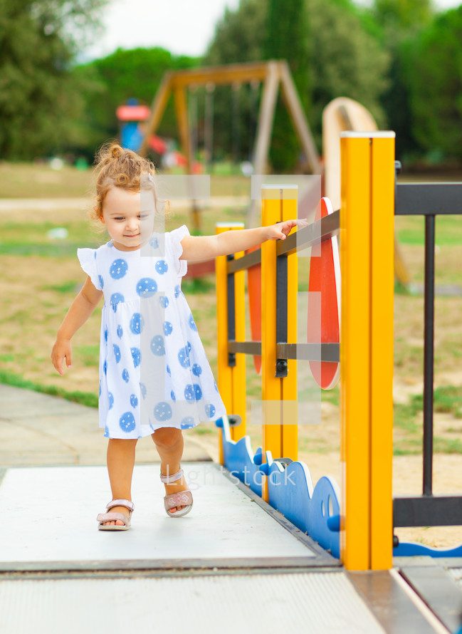 toddler girl on a playground 