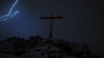 A stormy, dark Golgotha on Good Friday featuring three crosses.
