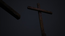 A stormy, dark Golgotha on Good Friday featuring three crosses.