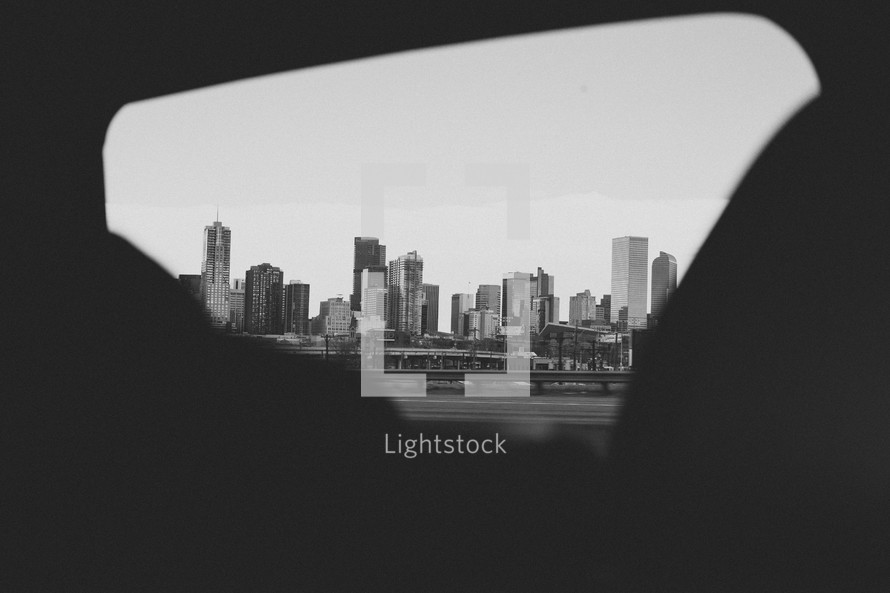 view of a city through a car window 