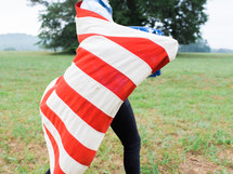 woman running with an American flag 