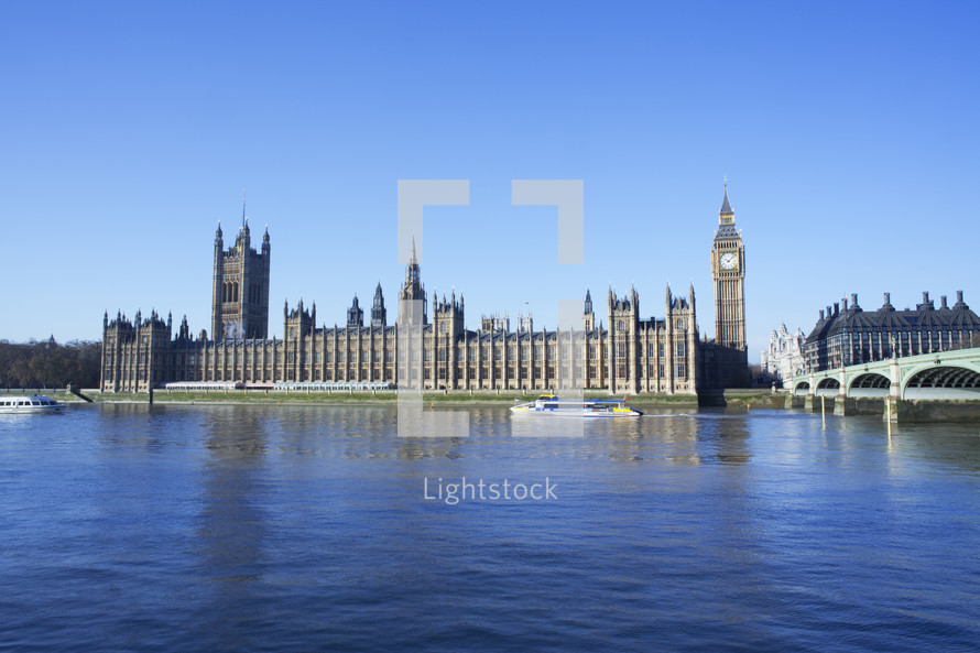 Big Ben and the Houses of Parliament from across the river thames during the day. London. England.